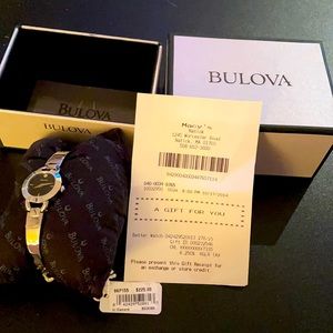 Brand new tag attached, in box, Bulova women’s watch. One diamond.